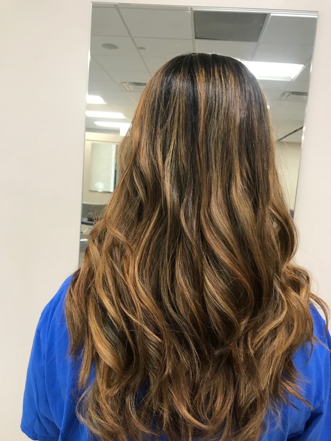 Hand-painted caramel balayage blending from a dark root through the lengths