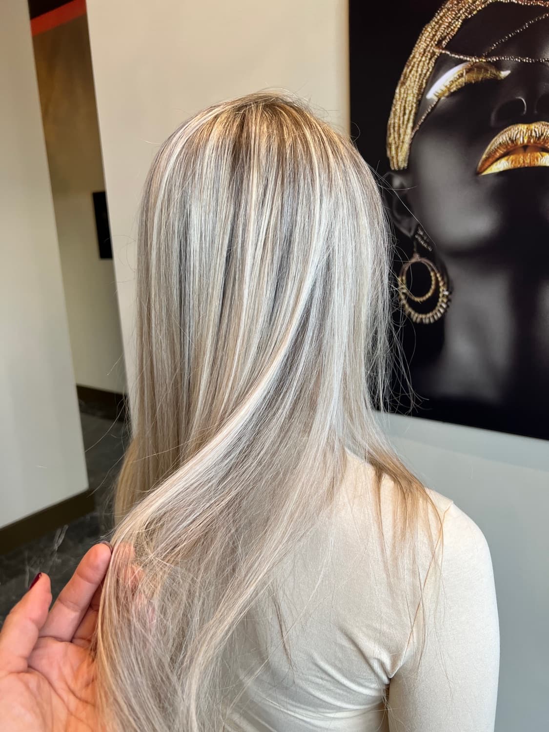 Cool platinum blonde achieved through corrective colour work